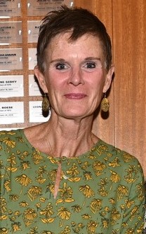 Mary Sorenson is seen smiling wearing a green blouse.